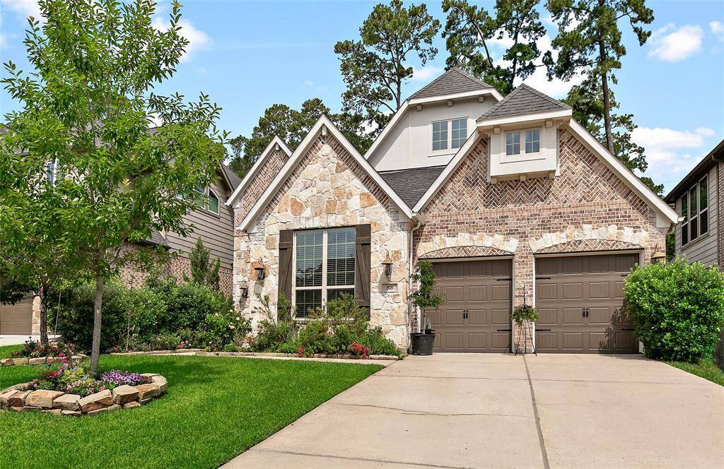 Two car garage with wide driveway for easy garage access.