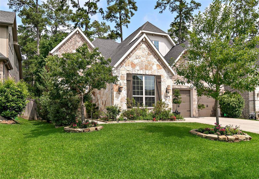 Greenbelt lot with mature trees and beautiful landscaping!