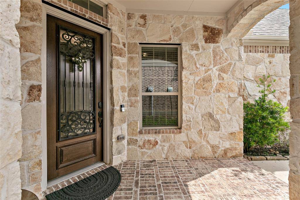 Lovely covered front porch welcomes you home!