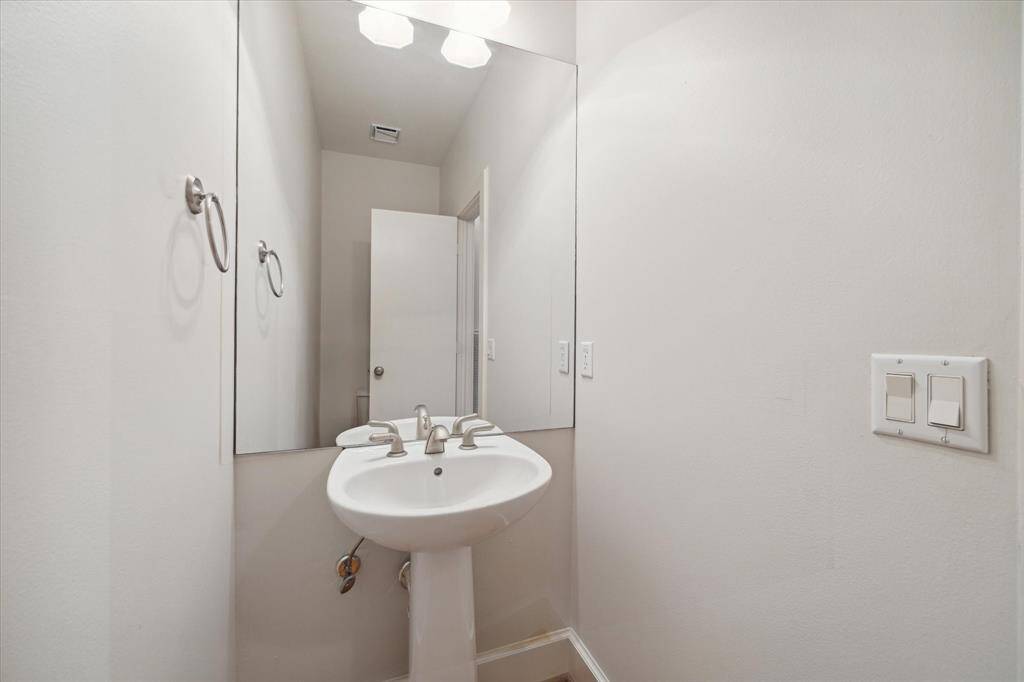 The half bathroom is off of the main living area.