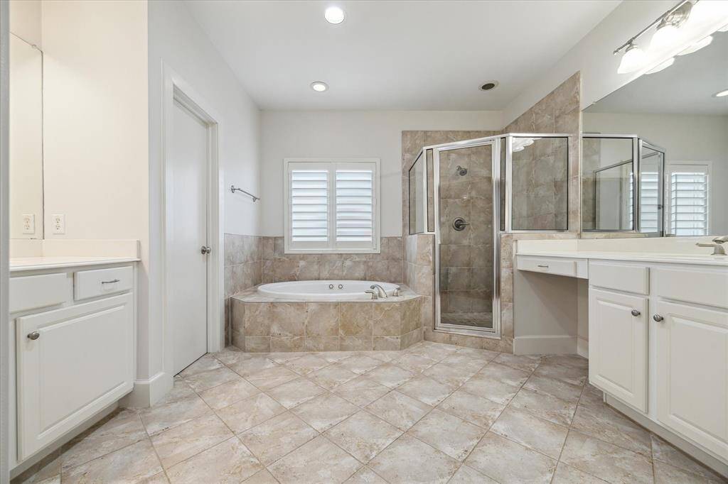 This en suite has a separate spa bathtub and shower.