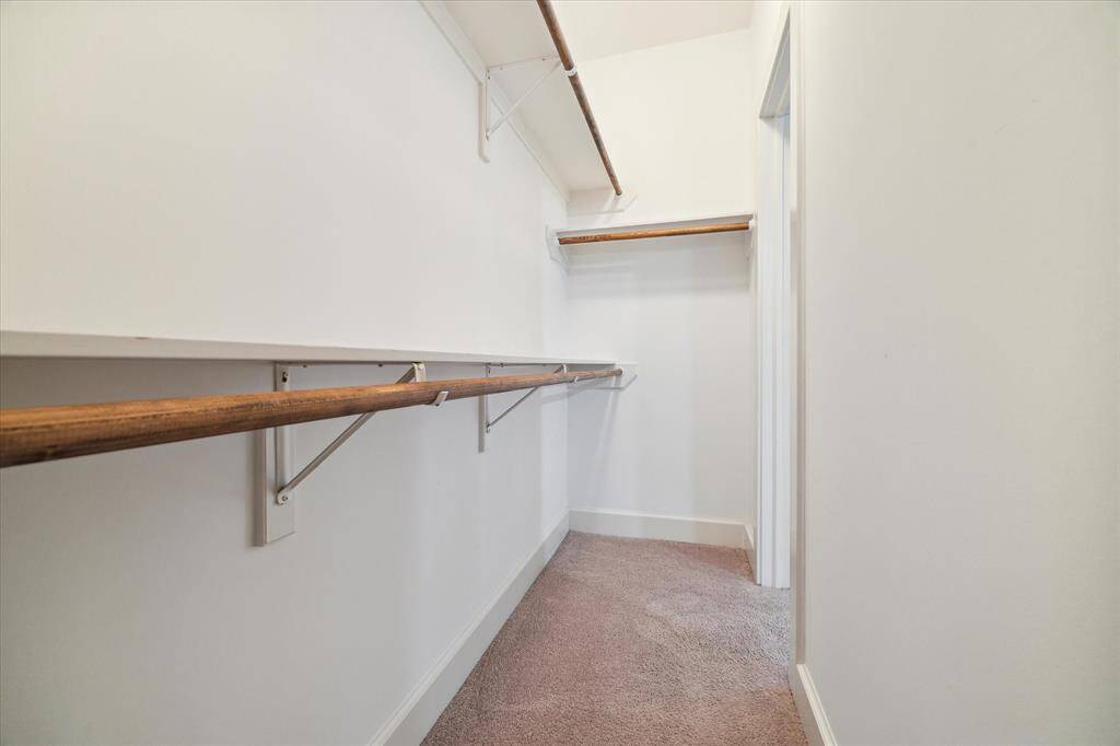 The main traditional style room holds this spacious closet.