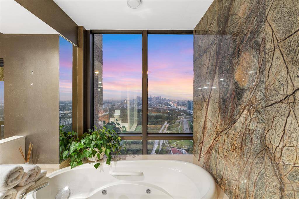 Spectacular views from the bathtub with slab stone surround.