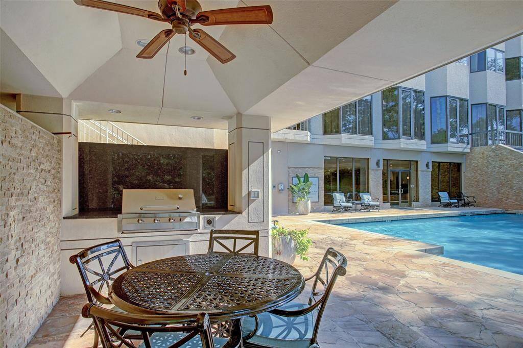 Covered grill overlooking the swimming pool.