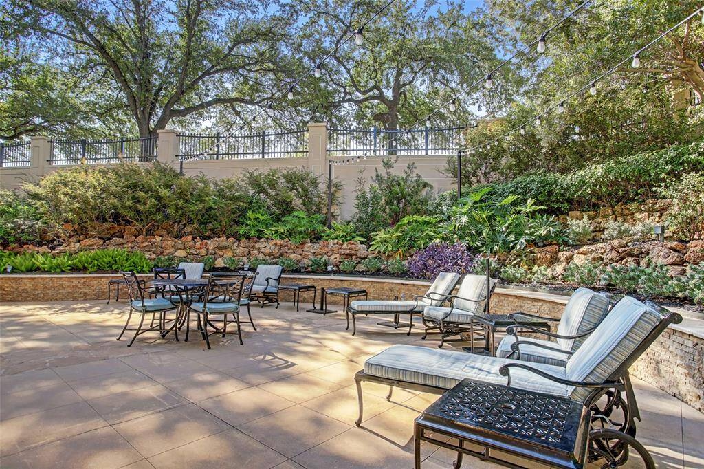 Beautifully landscaped grounds offer a wonderful lounging space near the pool.