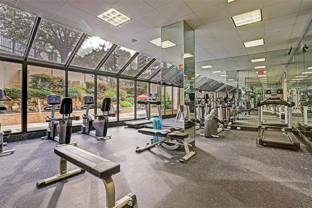 The fitness center overlooks the swimming pool and offers a dry sauna and steam area.