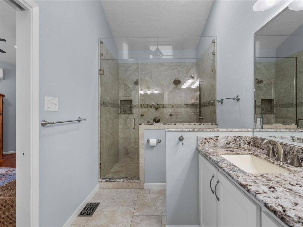 Spacious Walk-in Shower with Custom Glass Doors