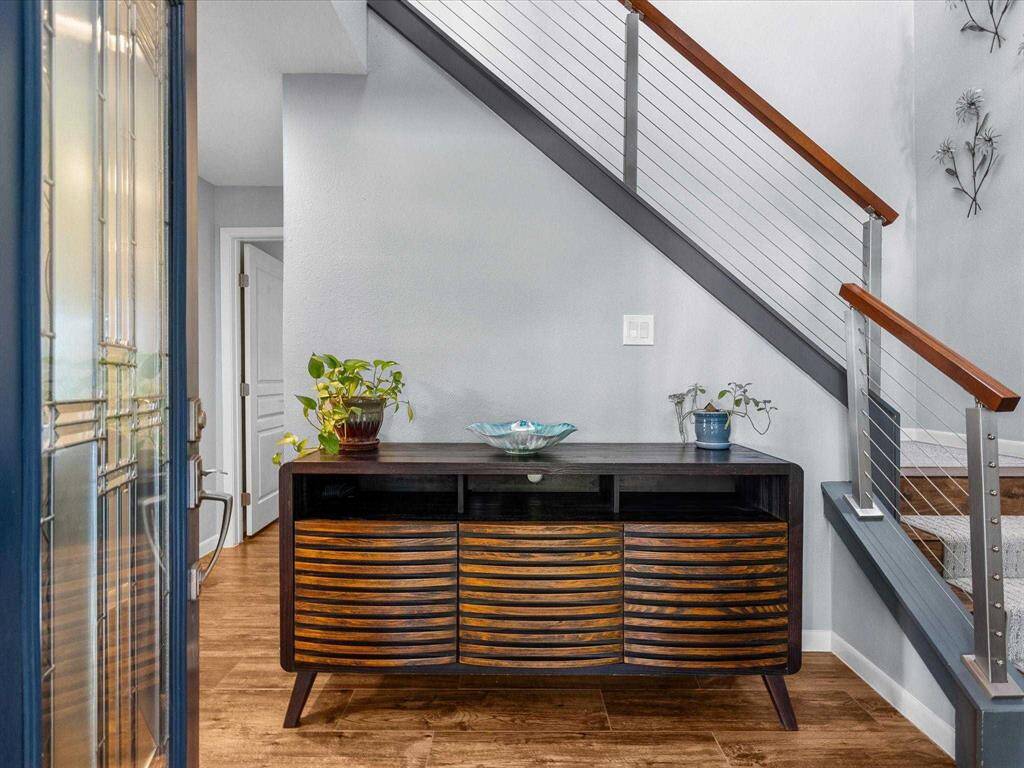 Open Warm Entryway with Sleek Cable Staircase. Bright and Welcoming Space