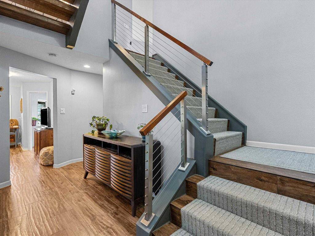 The Open Design Allows for Easy Access to the Upper Level While Maintaining an Airy Feel in the Home