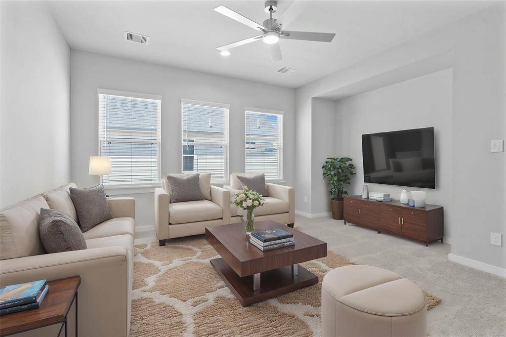 Perfect for entertaining is this amazing game room! Right upstairs this space would be a fabulous teen hangout or adult game room complete with enough room for a pool table and big screen TVs! Featuring plush carpet, high ceilings with ceiling fan, large windows with privacy blinds, and custom paint!