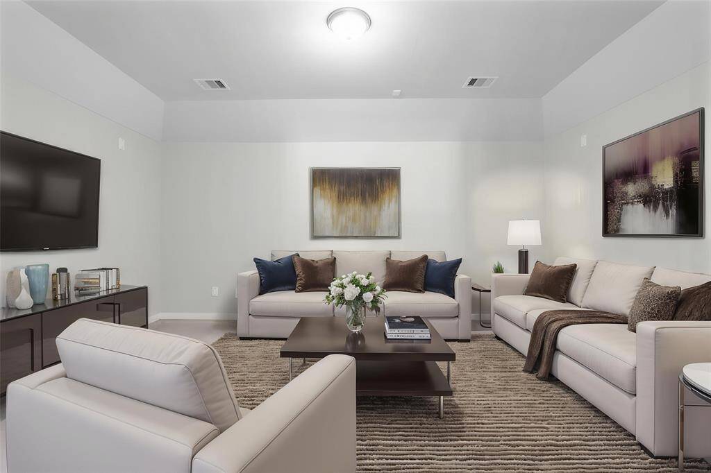 Grab the popcorn, put on a movie, and enjoy a wonderful evening in your amazing media room! Featuring plush carpet, custom paint, custom lighting, and double entry doors makes this the perfect room for relaxing!