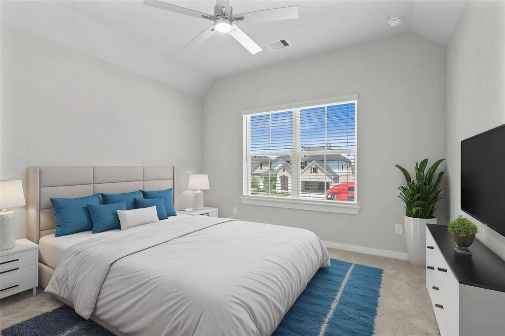 Secondary bedroom features plush carpet, custom paint, high ceiling with ceiling fan, large windows with privacy blinds, and ample closet space.