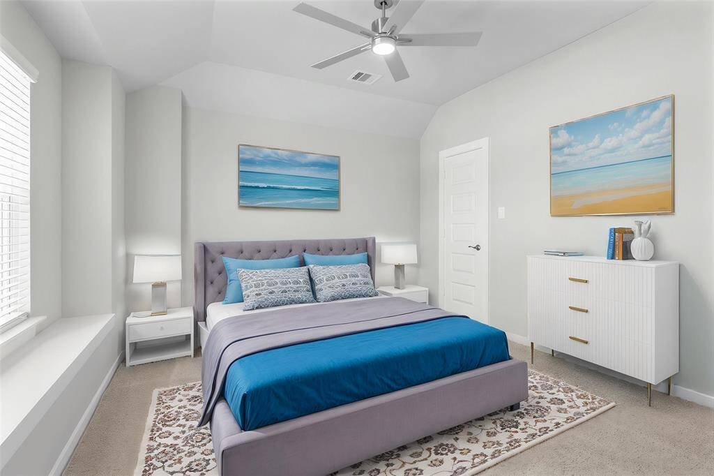 Secondary bedroom features plush carpet, custom paint, high ceiling with ceiling fan, large windows with privacy blinds, and ample closet space.