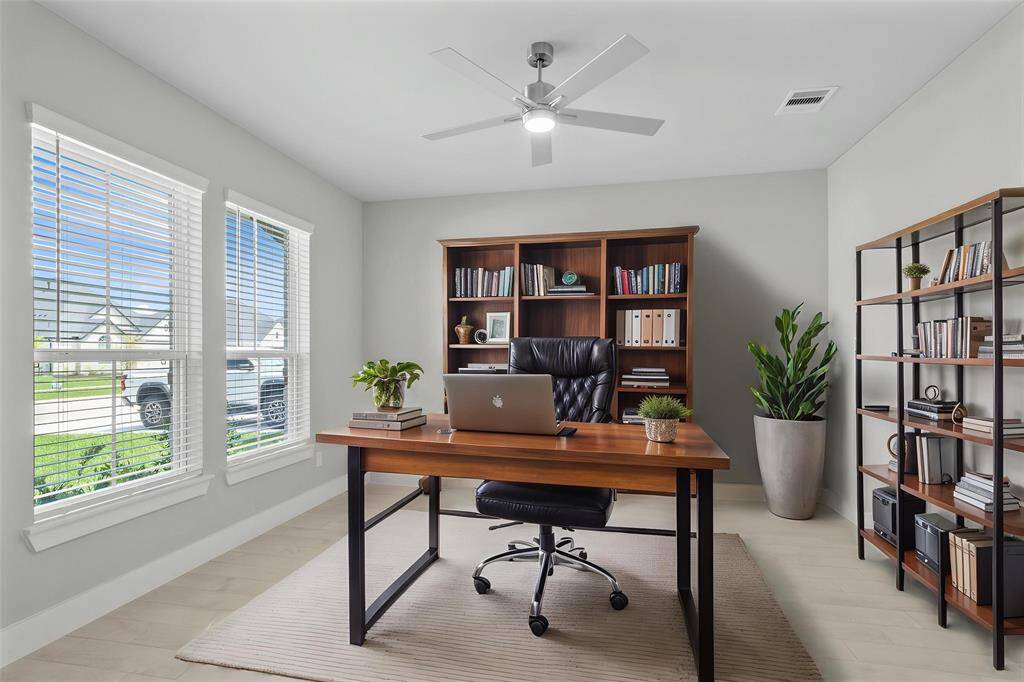 Come and unwind after a long day in this magnificent primary suite! This spacious room features plush carpet, warm paint, high ceilings, ceiling fan and large windows with privacy blinds.