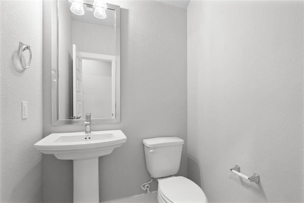 This additional view of the primary bath showcases a walk-in shower with tile surround and a separate garden tub perfect for soaking after a long day.