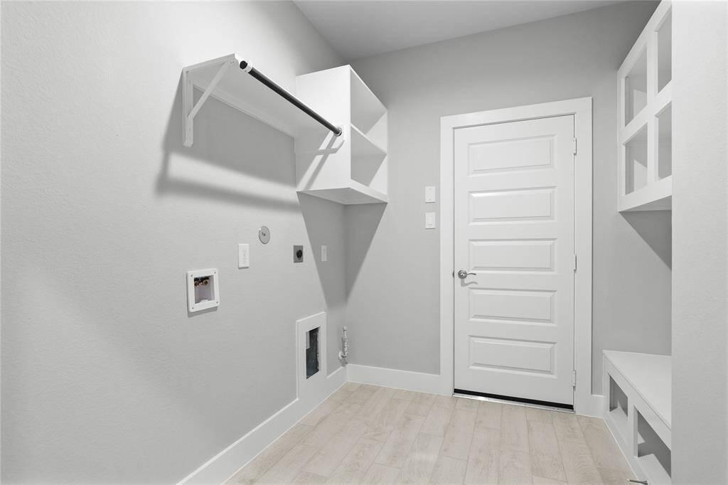 Secondary bedroom features plush carpet, custom paint, ceiling fan with lighting, large window with privacy blinds, and its own private vanity into shared jack-n-jill bathroom.