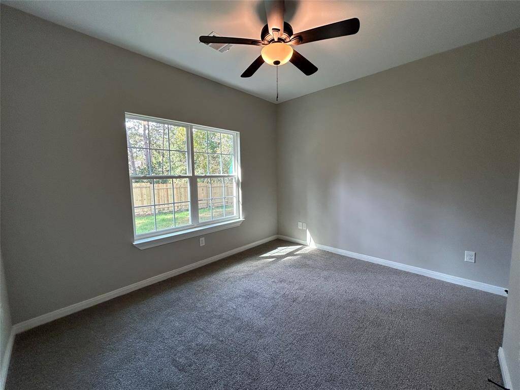 The second bedroom features the same plush carpet with views of the backyard filling the room with natural light!