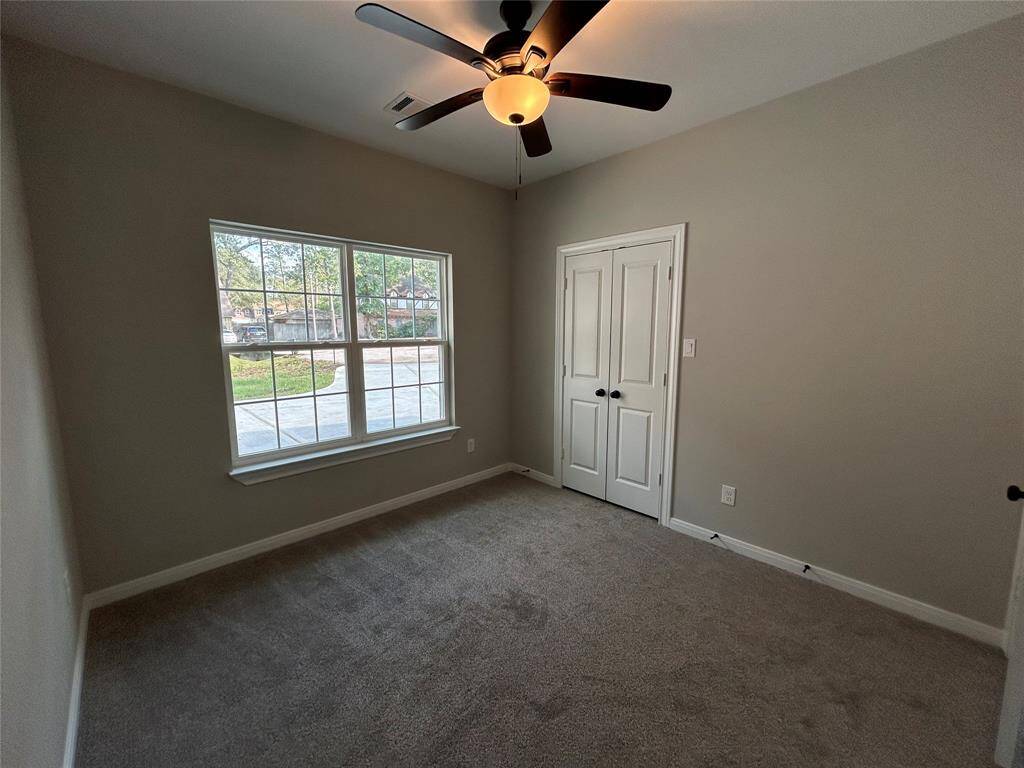 This third bedroom can be used as an office space or a third bedroom, with a large window!