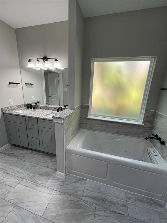 The tub features privacy glass for natural light and privacy!
