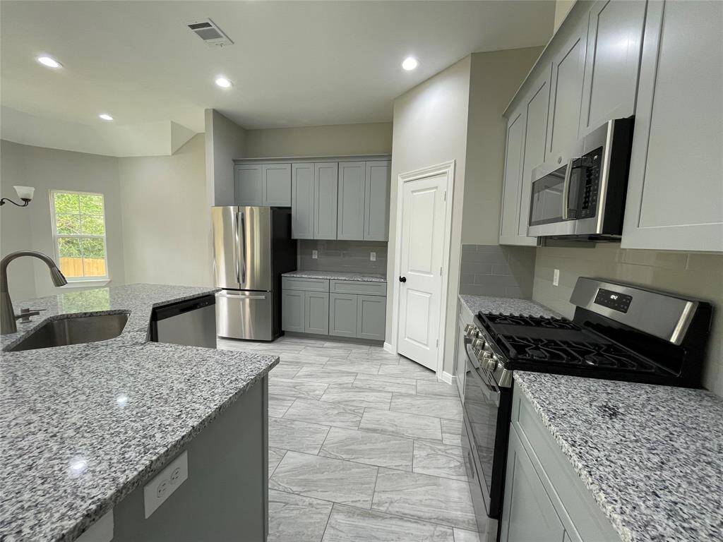 Your kitchen is equipped with stainless steel GE appliances, including a refrigerator! You also get a large pantry for plenty of storage! Each cabinet is equipped with soft close technology!