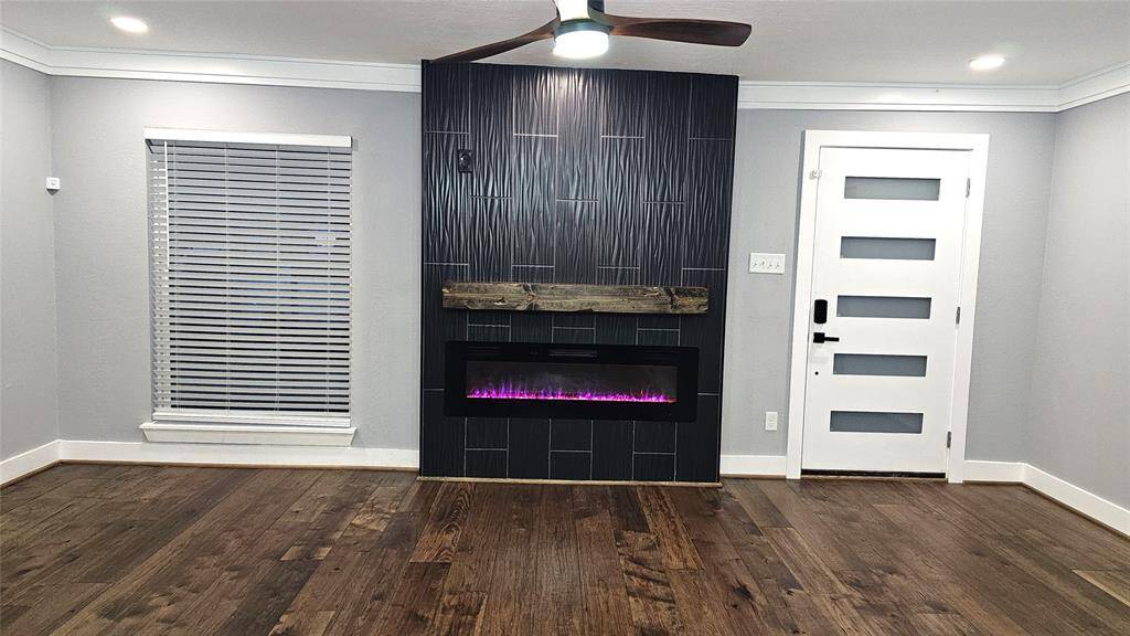 Beautiful and Modern Electric Fireplace with Custom Color Flames, 3 Dimensional Tile with Rustic Mantel and Prewired for Big Screen TV
