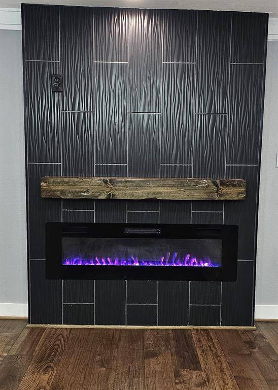Beautiful and Modern Electric Fireplace with Custom Color Flames, 3 Dimensional Tile with Rustic Mantel and Prewired for Big Screen TV