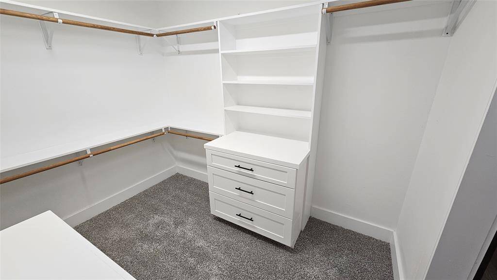 Primary Walk-In Closet with Built-in Cabinets with Soft Close Drawers