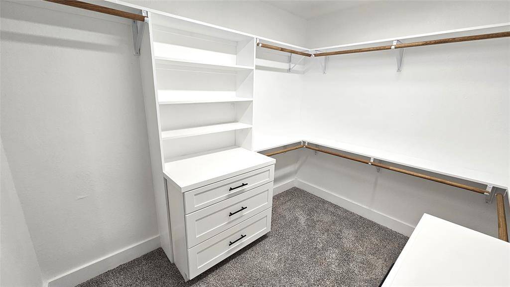 Primary Walk-In Closet with Built-in Cabinets with Soft Close Drawers