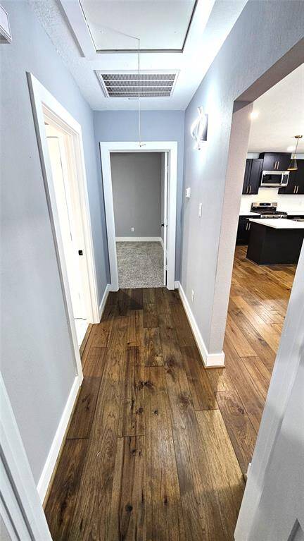 Hallway with Beautiful Engineered Hardwood Floors and Modern LED Lighting