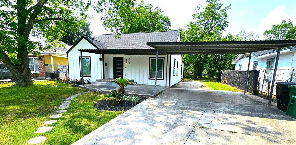 Beautiful Front Elevation with Covered Patio and Carport. Featuring New Hardie Siding, New Windows, New Roof, Modern 5 Lite Front Door, LED Lighting, etc....