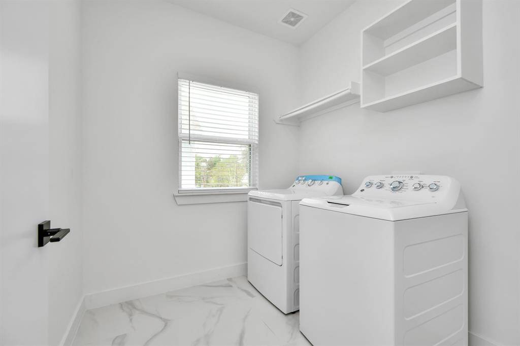 Spacious dedicated laundry area with plenty of room for large washer and dryer, ensuring that even the everyday household chores are completed in elegance with ease and efficiency