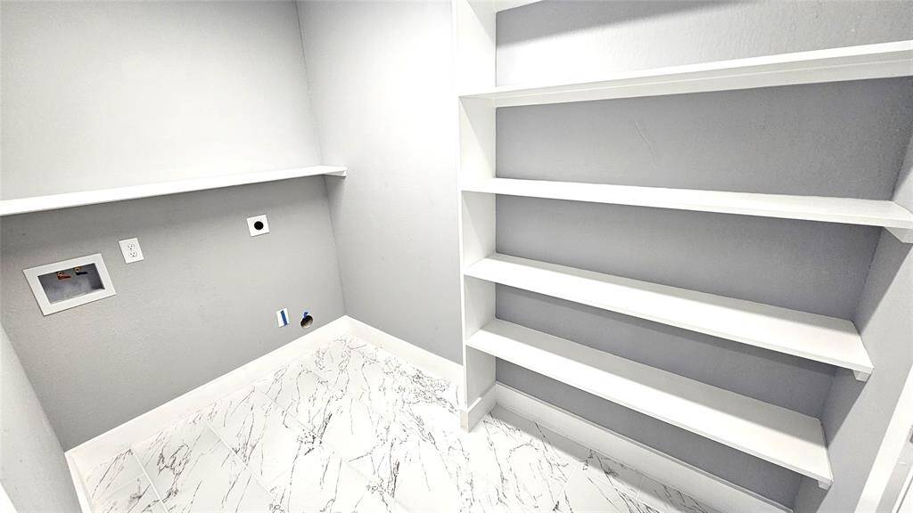 Utility Room with Washer/Dryer Connections and Built-in Shelves for Pantry and Backdoor to the Backyard