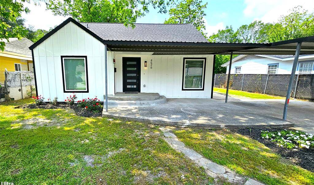 Beautiful Front Elevation with Covered Patio and Carport.  Featuring New Hardie Siding, New Windows, New Roof, Modern 5 Lite Front Door, LED Lighting, etc....