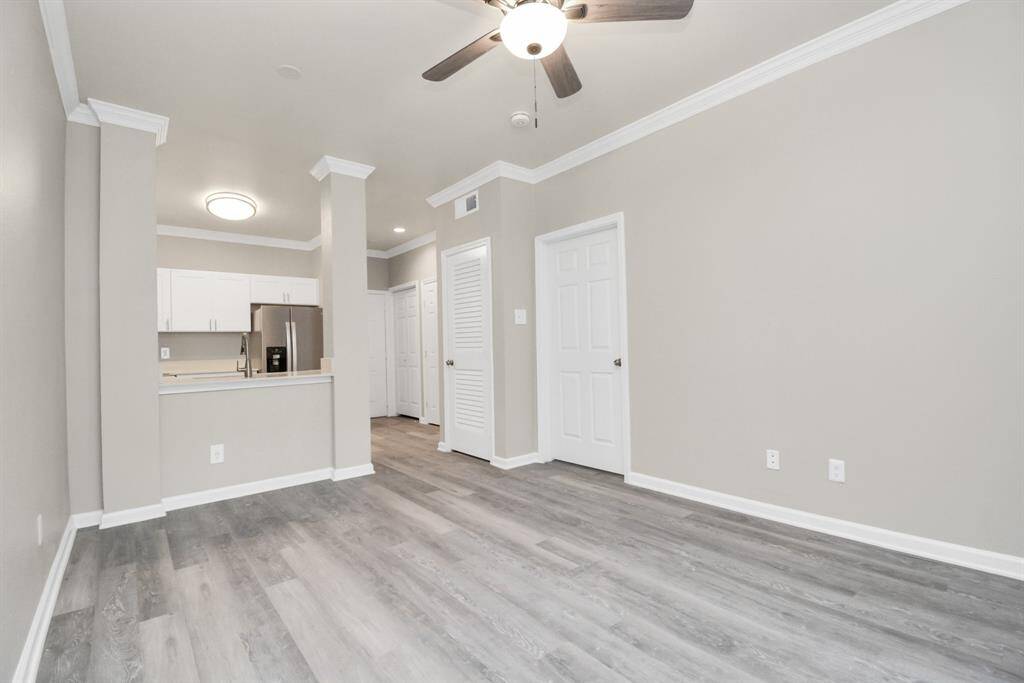 Photos displayed may be of similar apartments or floor plans featuring the same finishes. Living Room looking into Kitchen