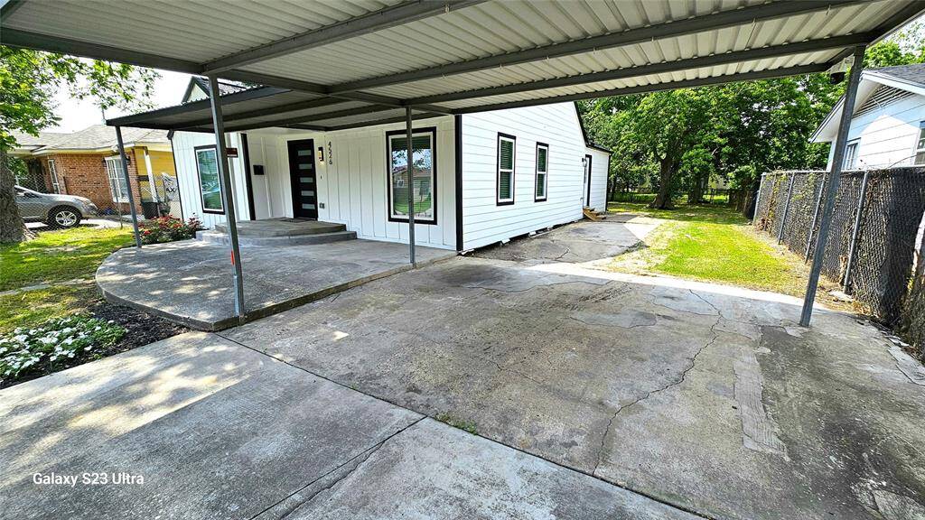 Beautiful Front Elevation with Covered Patio and Carport.  Featuring New Hardie Siding, New Windows, New Roof, Modern 5 Lite Front Door, LED Lighting, etc....