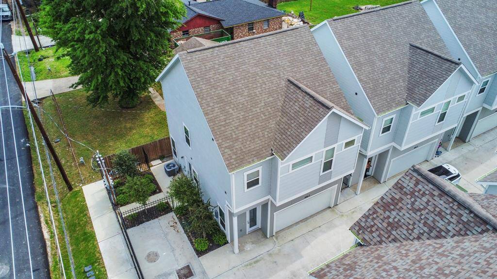 Bird's eye aerial shot of the house, showcasing its corner unit curb appeal