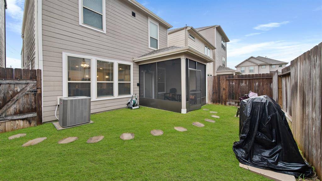 Step into the backyard oasis, with a covered screened in patio, creating aninviting outdoor retreat.