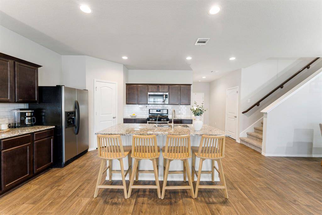 The island comfortably seats 4 bar stools—ideal for breakfast in the morning and a snack to end the day.