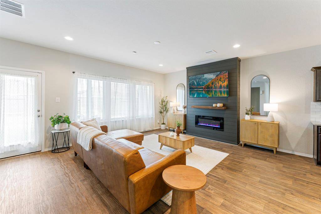 Enjoy relaxing by the cozy fireplace, perfect for spending time with family.