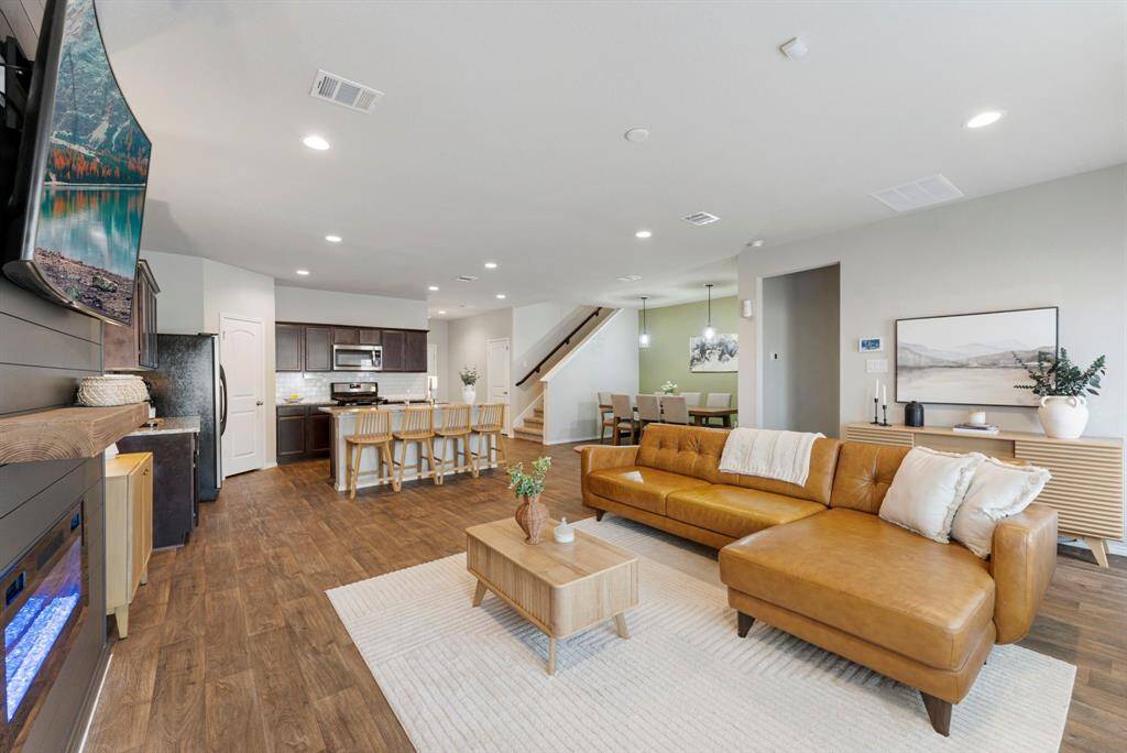 This space flows beautifully, offering plenty of room for family gatherings.