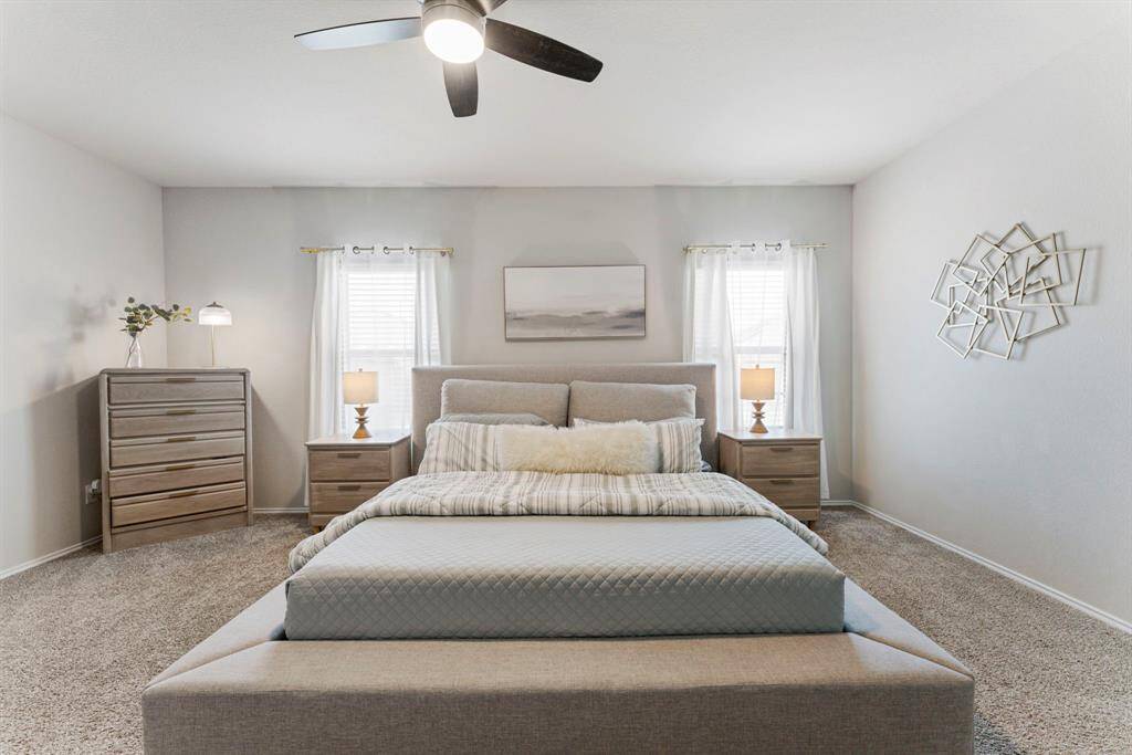Notice the updated, modern ceiling fan for added style and comfort.