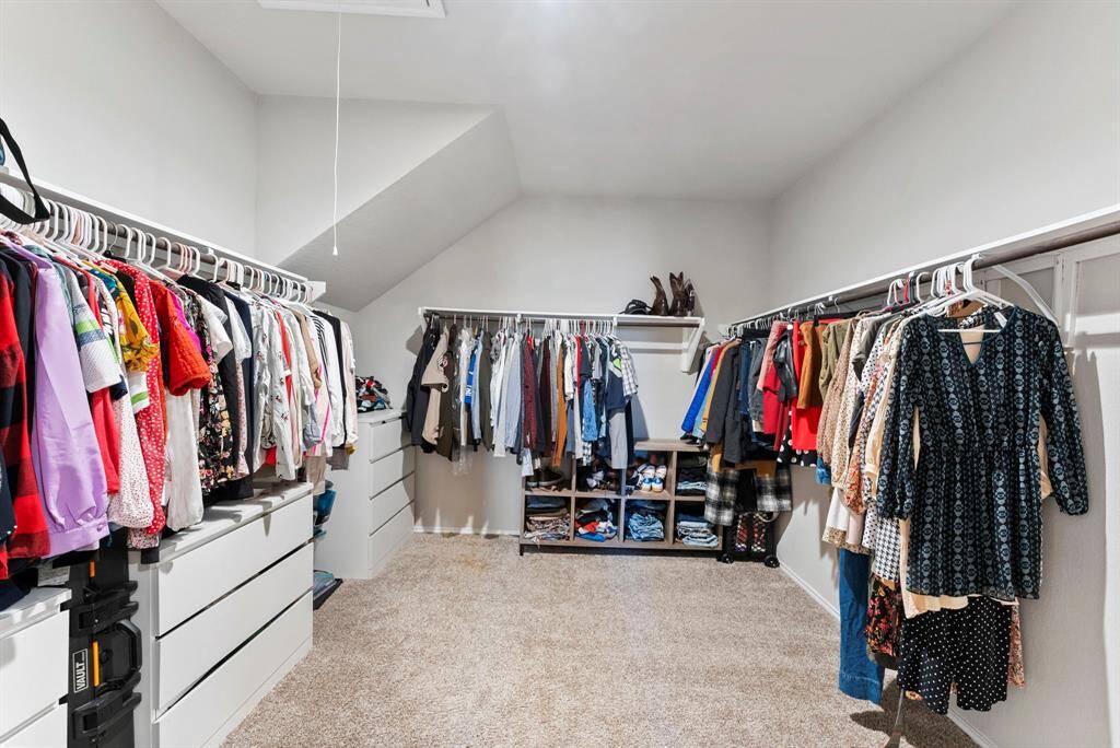 You'll love the spaciousness of this huge primary closet—plenty of room for all your storage needs!