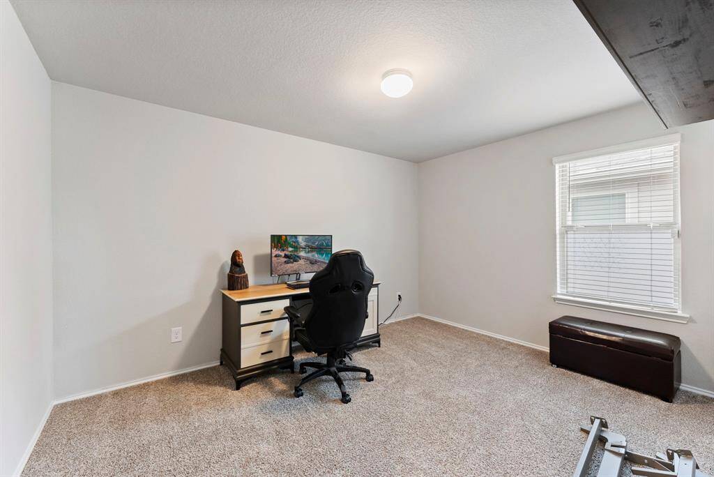 One of the spacious secondary bedrooms upstairs, perfect for guests or family.