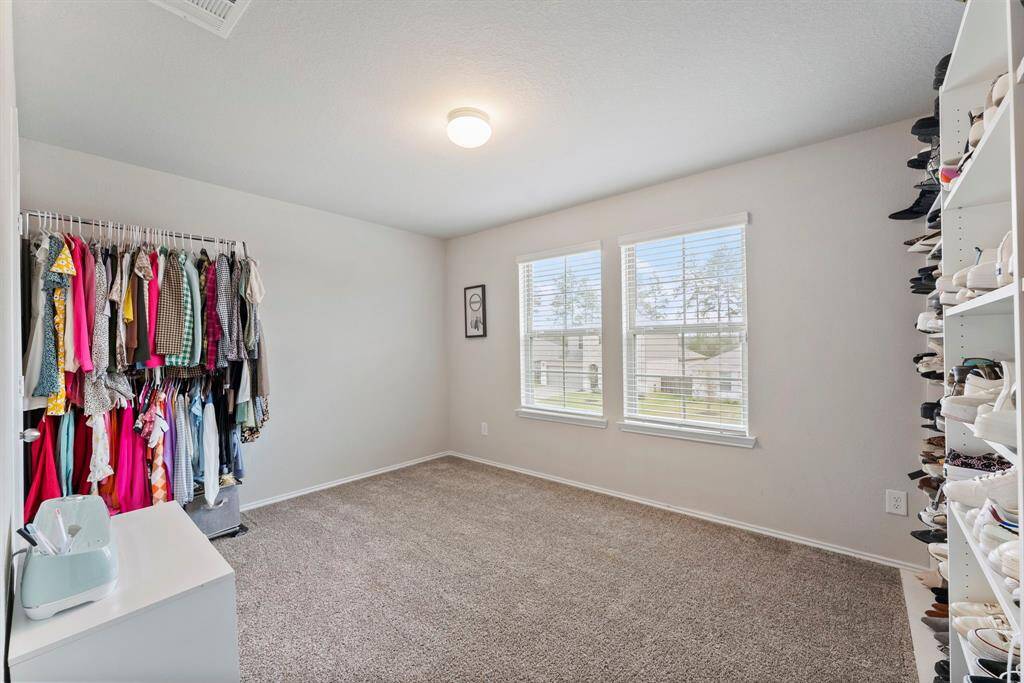 Another roomy secondary bedroom upstairs, ideal for family, guests, or a home office.