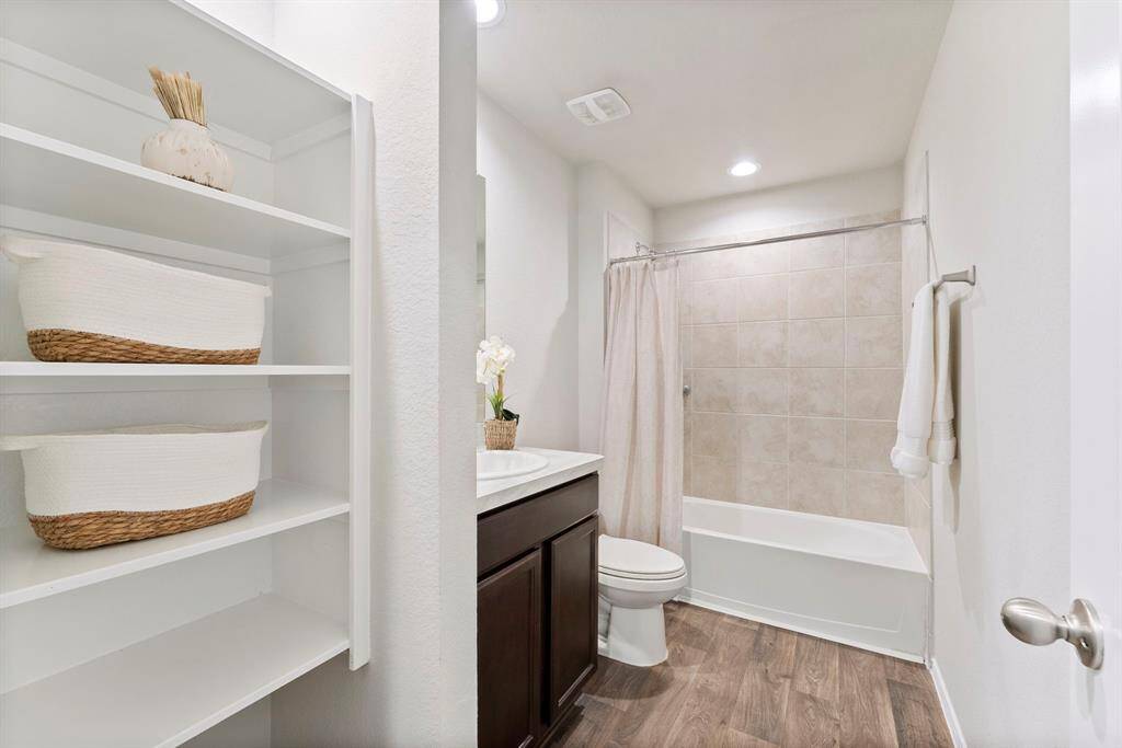 The full bathroom upstairs serves the two bedrooms and game room, adding convenience and functionality.