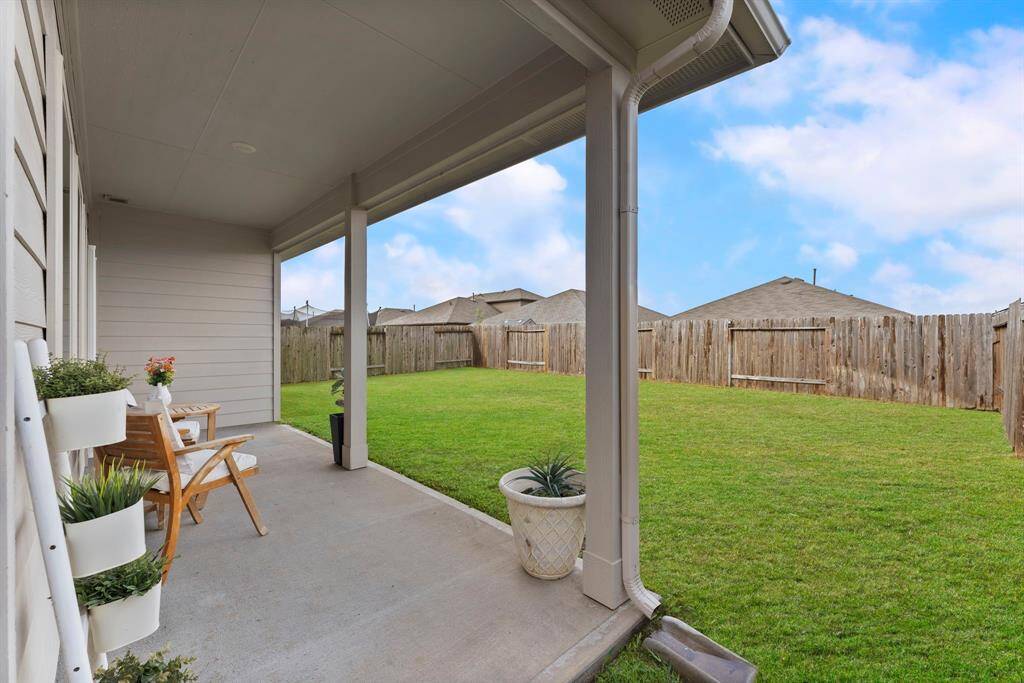 Watch the kids play in this generously sized backyard—plenty of space for fun and outdoor activities!