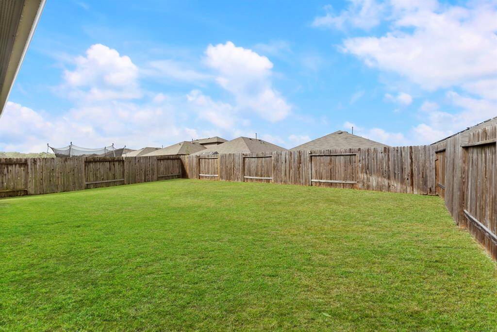 Plenty of room in this spacious backyard!
