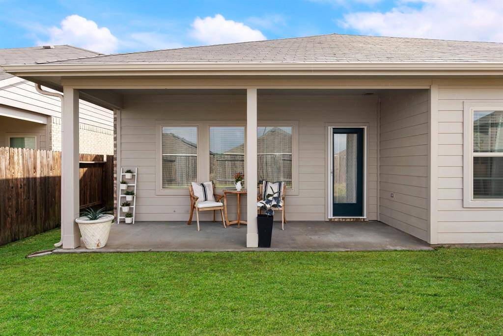 Here’s another view of the back patio, offering a great space for relaxing and entertaining.
