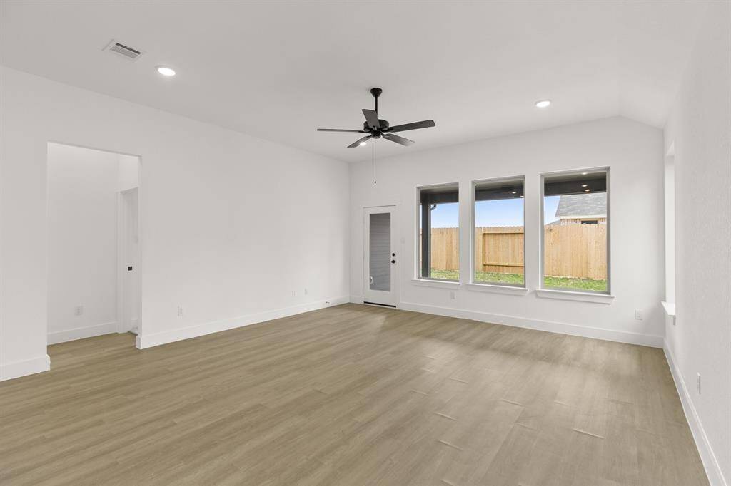 Imagine walking into a home that feels as expansive as it is inviting, bathed in natural l