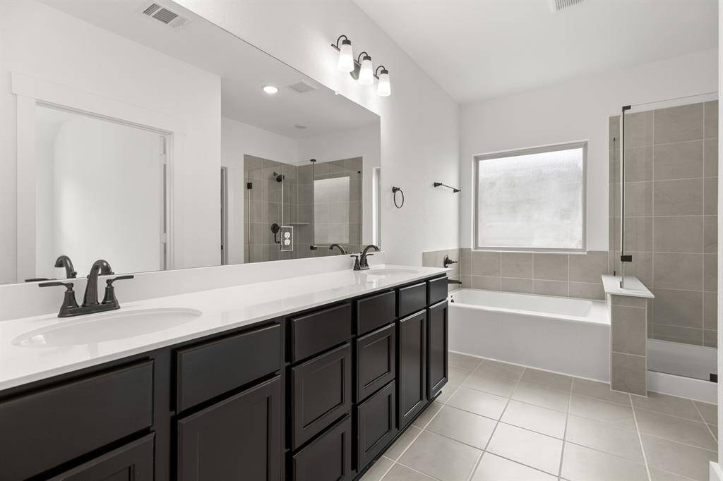 The soft glow of natural light filters through large windows, highlighting the elegant fin